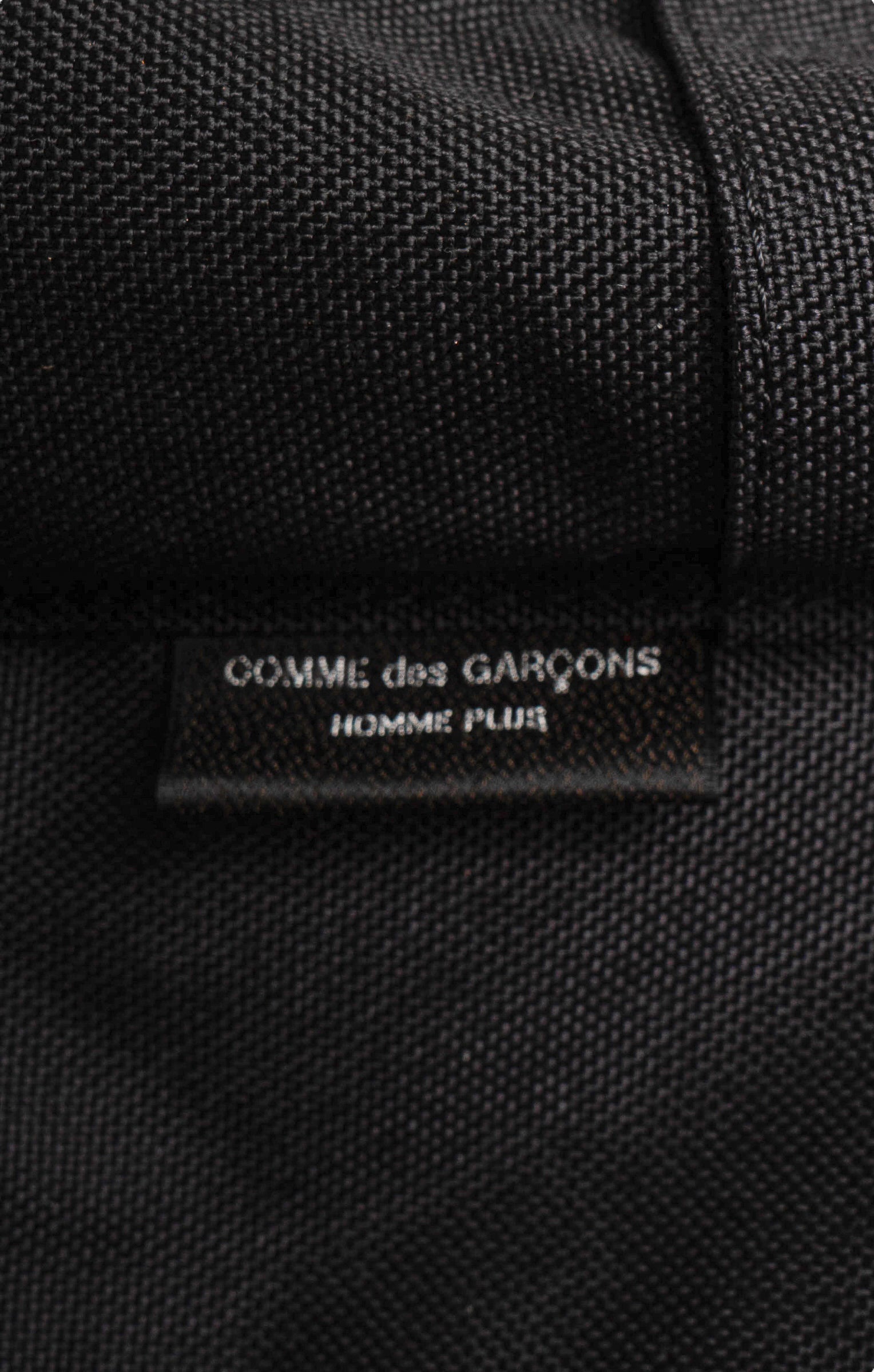 COMME DES GARÇONS Backpack Size: 10.5" x 6" x 17.5"; 2.5" drop handle