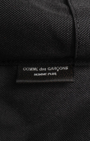 COMME DES GARÇONS Backpack Size: 10.5" x 6" x 17.5"; 2.5" drop handle