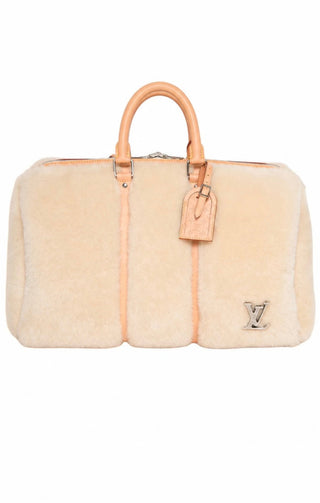 LOUIS VUITTON (RARE) Luggage Size: 18.75" x 9.5" x 11.5"; 4" drop handle