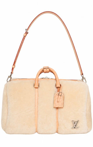 LOUIS VUITTON (RARE) Luggage Size: 18.75" x 9.5" x 11.5"; 4" drop handle
